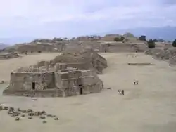  some ancient stone ruins of buildings in a sandy area