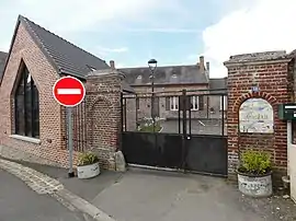 The town hall and school of Montigny-sur-Crécy