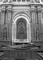 A stone tomb located within a cathedral.