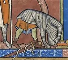 "David rejects the unaccustomed armour" (detail of fol. 28r of the 13th century Morgan Bible). The image depicts a method of removing a hauberk.