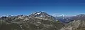 Mountain peak near the snow line and several mountain peaks above the snow line