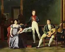 An oil painting depicting two men, dressed in 19th century attire, gathered around a table. The man on the right is playing the guitar.