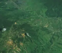 A satellite image of Wau and its mines, looking towards Bulolo