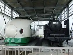 Preserved car 221-1510 outside the Niigata City Niitsu Railway Museum in August 2014