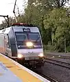 NJ Transit ALP-46 No. 4653 pulls up to the high level platform at Gladstone Station