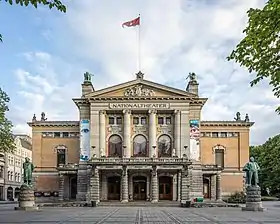 Building with stone columns at the base, and marble columns on the top portion.