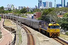 NR28 in Indian Pacific livery with the eastbound Indian Pacific at Mt Lawley, 2014.