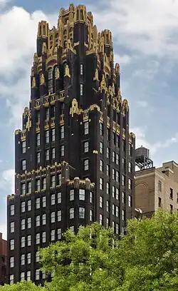 Older skyscraper, with trees in front