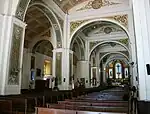 The massive arcades and columns inside the cathedral, designed to counter the effects of earthquakes