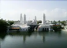 A panoramic view of Nagore Dargah; Dome, Sacred water tank and the five minarets