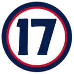 The number "17" in navy blue set against a white circle with a red and navy border