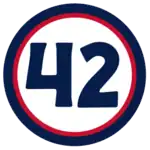 The number "42" in navy blue set against a white circle with a red and navy border