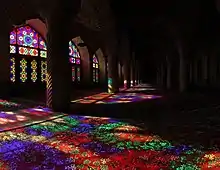 Extensive stained glasses of Nasir-ol-Molk Mosque in Shiraz, Iran and the light passing through them