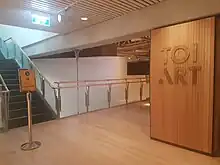 Sign, corridors and stairs at the entrance of the art gallery