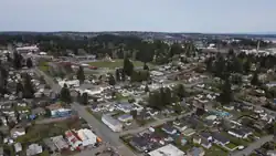 Aerial view of the neighborhood, with West Hills S.T.E.M. Academy  in the center left and Puget Sound Naval Shipyard on the far right.