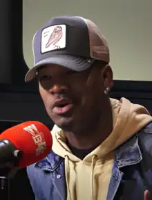 Ne-Yo speaking into a microphone