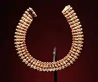 Necklace made of 54 composite human head and ram's head gold pendants with a small carnelian bead between each. Meroitic Period, 270–50 BC