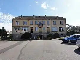 The town hall and school in Neufmaisons