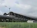 A commuter train leaving New Taipei Industrial Park