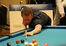 Niels Feijen playing a shot