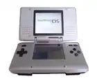 Nintendo's Nintendo DS (pictured) and Game Boy Advance were the best-selling portable systems of the decade. Games released for the Nintendo DS in the 2000s included Super Mario 64 DS, Brain Age: Train Your Brain in Minutes a Day!, Nintendogs, New Super Mario Bros., Pokémon Diamond and Pearl, and Grand Theft Auto: Chinatown Wars.