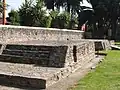 North altar to the side of the pyramid. The snake sculpture is between the two platforms