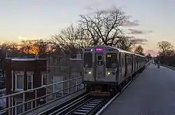 A Pink Line train traveling along 21st Street in Lawndale.