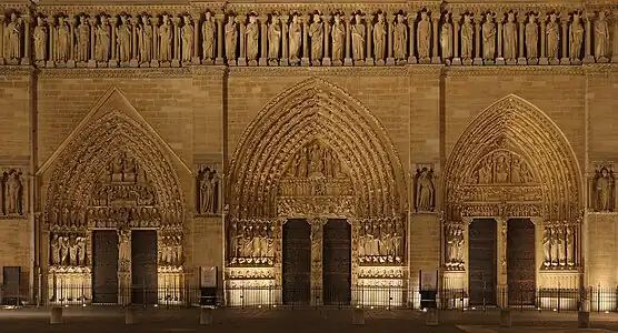 The three tympana on the main façade of Notre-Dame de Paris, France