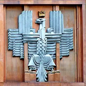 Polish coat of arms (unofficial) in Art Deco style, on the facade of the post office in Warsaw (architect Julian Puterman-Sadłowski 1934).