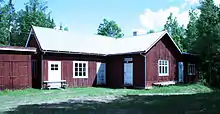 A small building with "Bakeri" written on a sign over the door