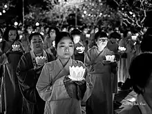 Buddhists and monks prepare to water lanterns on the occasion of Vu Lan