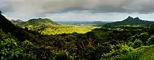 Nuʻuanu Pali, a section of the Koʻolau Range. Olomana is visible on the right side of the image.