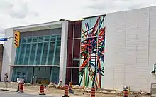 Main entrance of Oakwood station depicting a photograph of pick-up sticks on a white background