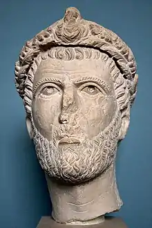 Head of a ruler. Head of a man wearing a wreath