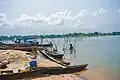 Cassava fermentation process by rural women and canoes at Oguta Lake.