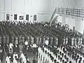 Flag raising ceremony in the hall at the old NYJC campus in 1980.