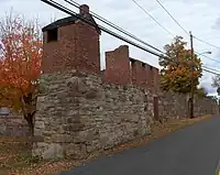 View of same wall as the postcard in 2010