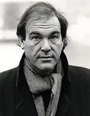 Black-and-white picture of Oliver Stone looking to the camera.