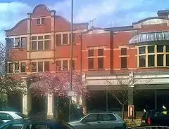 A street view of the front of a facebrick building.