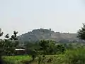 Long shot of Jejurigad's mandir on mountain