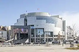 exterior view of midrise building, which uses materials of glass and metal