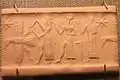 God with ax attacks eagle while Shamash and Worshipper stand behind