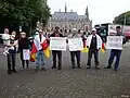 Protestors with Ossetian flags in front of the seat of the International Court of Justice in The Hague