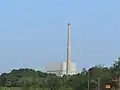 A close-up view of the Oyster Creek complex with the reactor building & off gas stack.