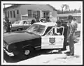 Old patrol car in the 1960s, with Puerto Rico Governor Roberto Sánchez Vilella.