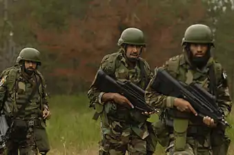 Members of the Special Service Wing (Pakistani Air Force) armed with F2000 rifles during a training exercise at Fort Lewis, Washington, US, July 23, 2007.