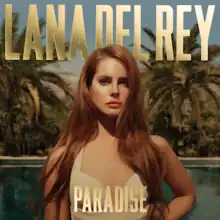 Clad in a gold-colored one piece swimsuit from the waist up, a Caucasian female with red-painted lips and a long, brownish red hair stares forward before a tropical background with the words "Lana Del Rey" above her and the word "Paradise" below in all capital letters.