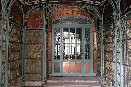 Breezeway of the Castel Béranger, with wall plates by Alexandre Bigot