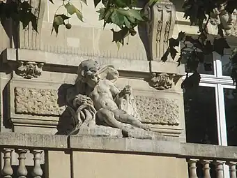 Beaux Arts putto on a balcony balustrade of the Hôtel Claridge (Avenue des Champs-Élysées no. 74), designed by Charles Lefebvre or Louis Duhayon, 1914