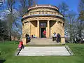 Parrot House, in the grounds of Eaton Hall, a very rare example of Waterhouse designing a neo-classical building, also the use of bright yellow terracotta is atypical